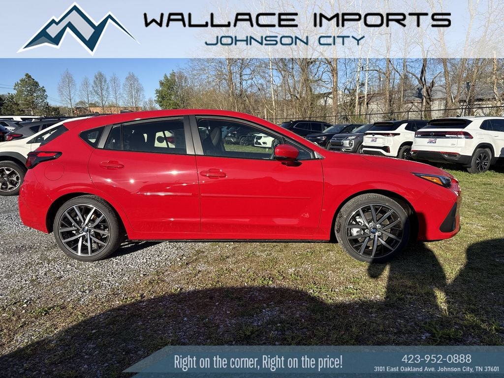 2026 Subaru IMPREZA Sport in Pure Red — front three-quarter view