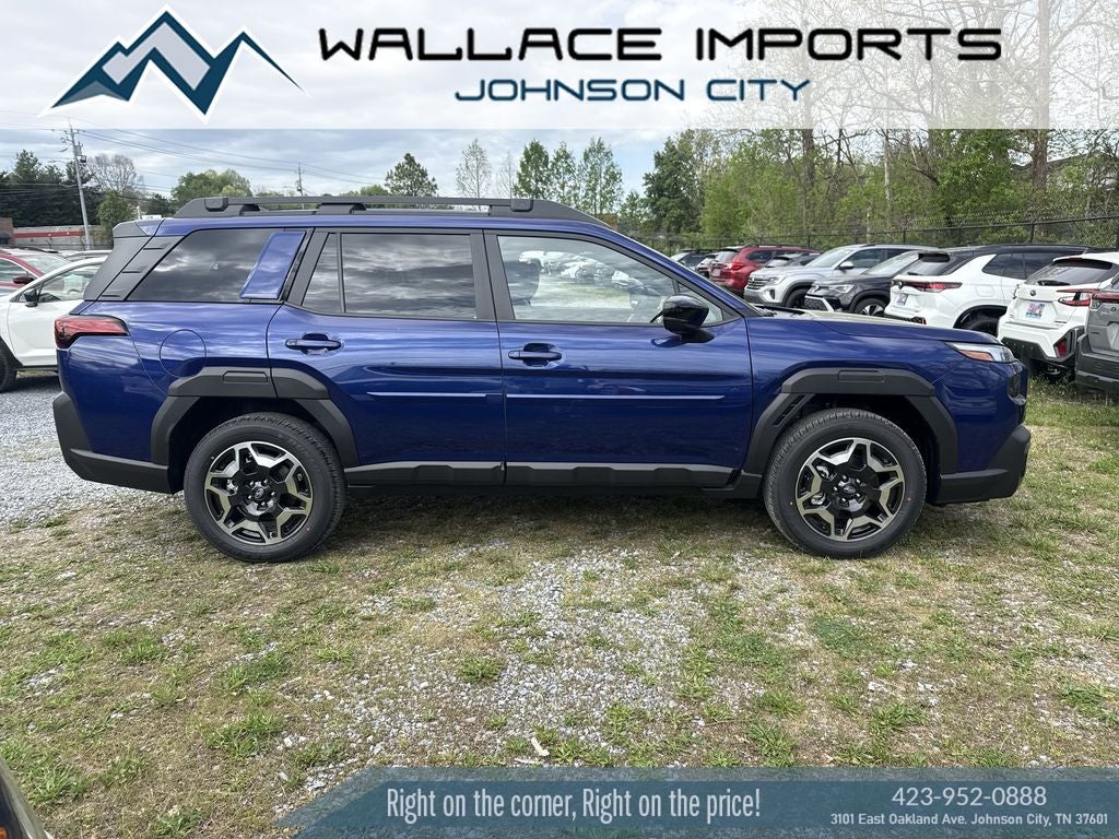 2026 Subaru OUTBACK Touring in Sapphire Blue Pearl — front three-quarter view